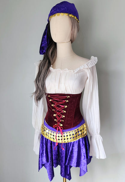 Mannequin wearing a costume with a white top, red corset, purple skirt, and purple headscarf on a gray background.